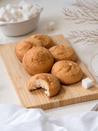 homemade biscuit cookies on a bamboo board, a cup of coffee, refined sugar - still life in light colorsの写真素材