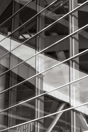 fragment of a building with large glass windows. Black and white photoの写真素材