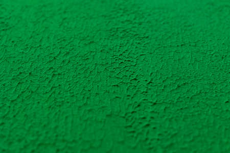 close-up of a green wall with a raised surface, the middle is in sharp focus, the edges are blurredの写真素材