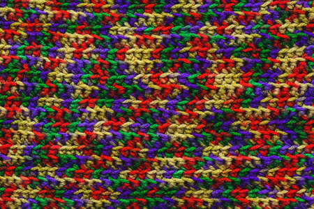 threads background: a close-up of a multi-colored wool knitted sweaterの写真素材