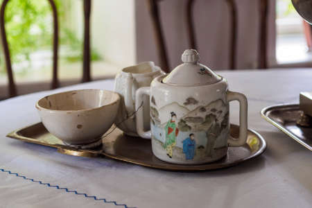 Taganrog, Russia - October 3, 2020: part of the exposition - an old sugar bowl, gravy boat and a cup in the museum "Chekhov's House"のeditorial素材