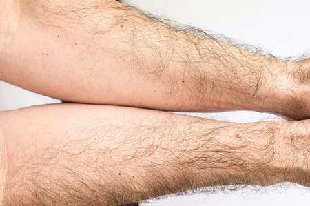 male hands with long black hair close up