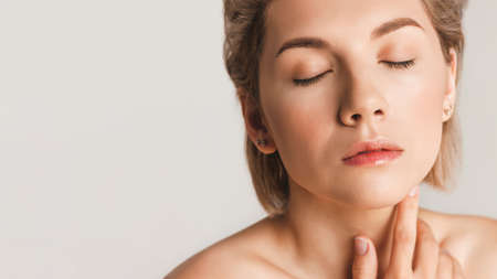 Attractive relaxed girl with closed eyes. Healthy skin concept. Copy space for text