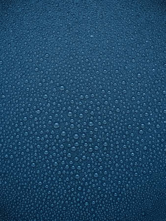 abstract blue background: drops of water on a dark surfaceの写真素材