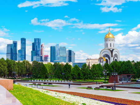 Moscow, Russia - May 24, 2021: view of the Moscow City and the Temple of St. George to the Poklonnaya Hill in Victory Parkのeditorial素材