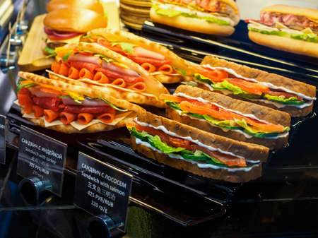 Moscow, Russia - May 26, 2021: Turkey and salmon sandwiches, burgers on the counter of a diner at Domodedovo airportのeditorial素材