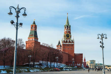 View of the walls and towers of the Moscow Kremlin with a clock on Red Squareの写真素材