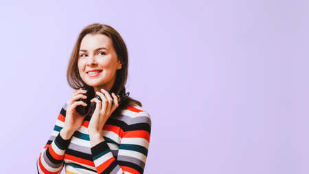 happy young woman smiling and looking at copy space. Music listening conceptの写真素材
