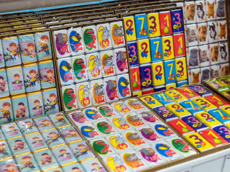 MOSCOW, RUSSIA - JULY 08, 2021: Many Gift Sets of Chocolates for Children with Animals, Numbers and Russian Alphabet on the Shop Counterのeditorial素材