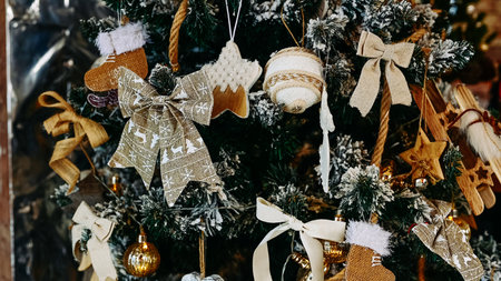 christmas tree with wooden and fabric toys close upの写真素材