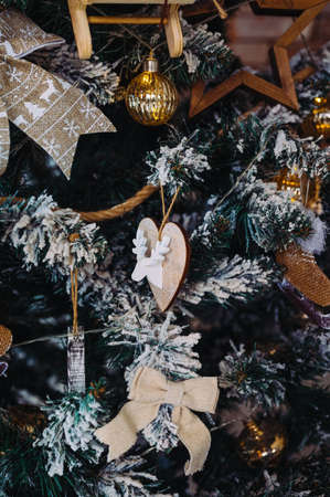 beautiful handmade wooden and fabric toys on the Christmas treeの写真素材