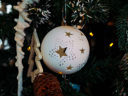 white christmas toys and garland lights close upの写真素材