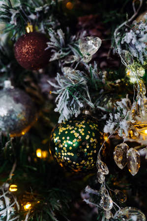 multicolored toys on christmas tree close upの写真素材
