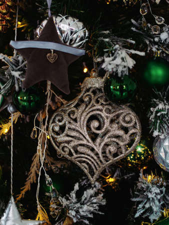 multicolored vintage toys on christmas tree close upの写真素材