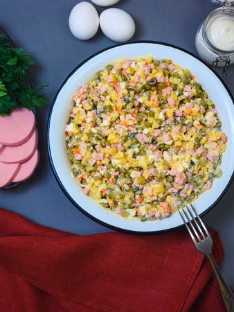 Russian New Year salad Olivier in a large enamel bowl - flatlayの写真素材