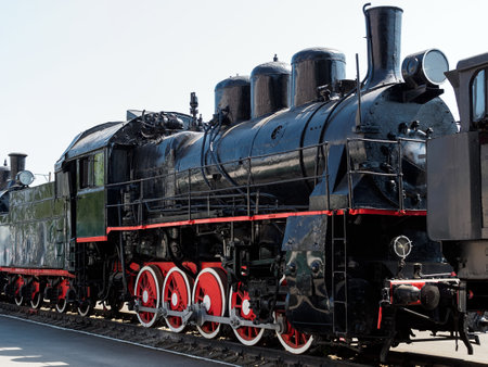 vintage black steam locomotive outdoorsの写真素材