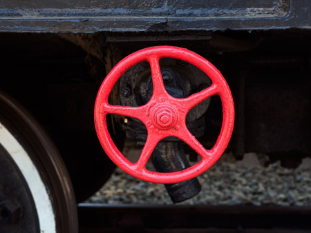 red valve on an old train close-upの写真素材