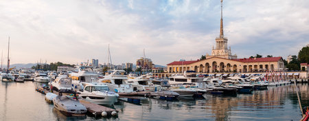 Sochi, Russia - August 23, 2022: View of the sea port and yachts at sunset - panoramaのeditorial素材