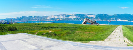 Novorossiysk, Russia - June 4, 2023: Museum "Malaya Zemlya", Tsemesskaya bay of the Black Sea and the port in summer - panorama. The ruins of the Turkish fortress Sujuk-Kaleのeditorial素材