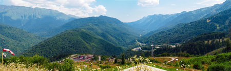 Panorama: View of the Caucasus Mountains, Khargin forest on a sunny day in summerの写真素材