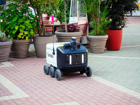 SOCHI, RUSSIA - August 05, 2022: Yandex courier robot in the city. Food delivery from the cafeのeditorial素材