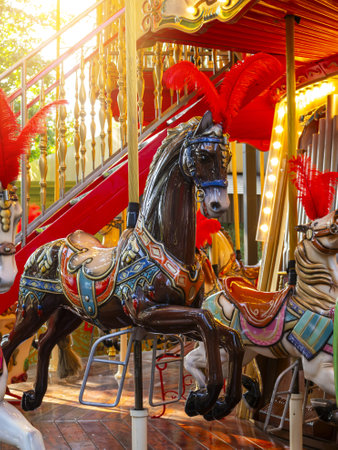 brown circus horse on a merry-go-round in an amusement parkの写真素材
