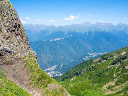 At the peak of the "Black Pyramid" at an altitude of 2375 meters above sea level, a view of the Caucasus Mountains in summer on a sunny dayの写真素材