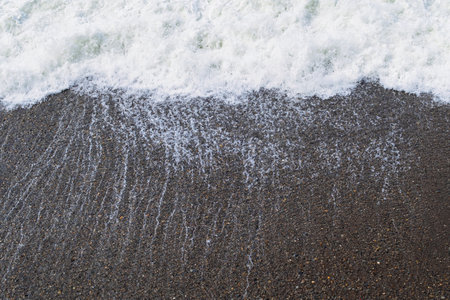 a wave on the coastline, top viewの写真素材
