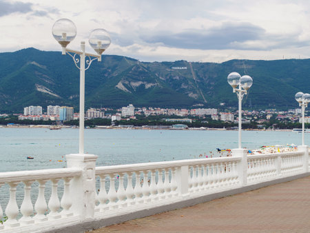 view of the Markotkh ridge and the inscription "Gelendzhik" in Russian from the embankment in summer on a cloudy dayの写真素材