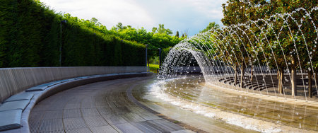 a place to relax near a fountain in a public park - panoramaの写真素材