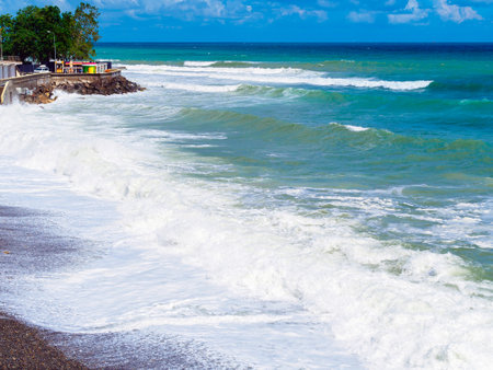Turquoise and blue water, sea waves and foam off the coastの写真素材