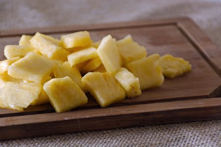 Cut Pineapple on Cutting Boardの写真素材