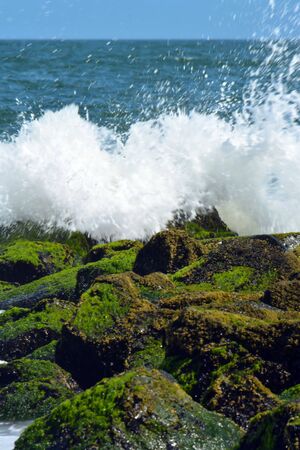 Waves Splashing Against Jetty Rocksの写真素材
