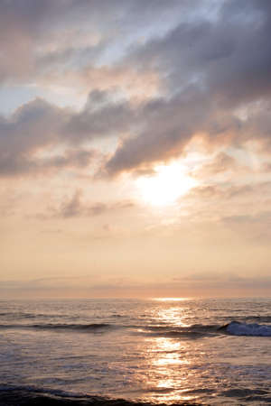 Heavenly and Magical Early Morning Summer Sunrise at the Shoreの写真素材