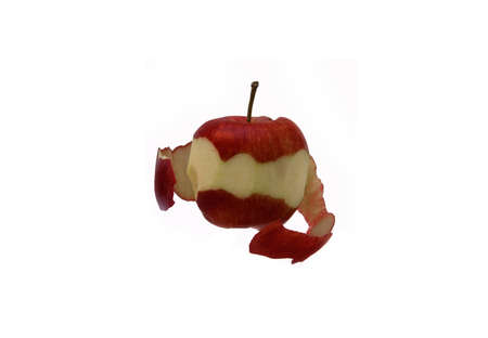 An apple peeling itself on a white backgroundの写真素材