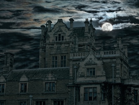 Spooky moon rise over old house in England Ukの写真素材