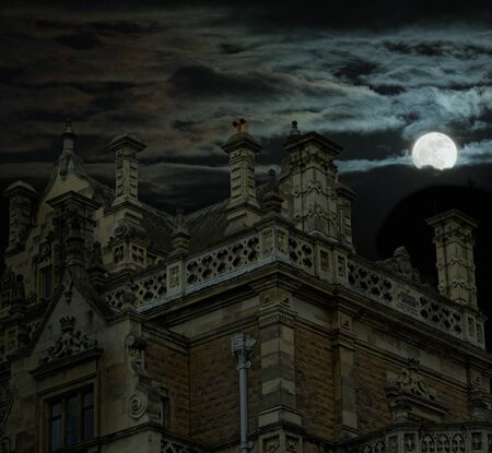 Spooky house at night with moonの写真素材