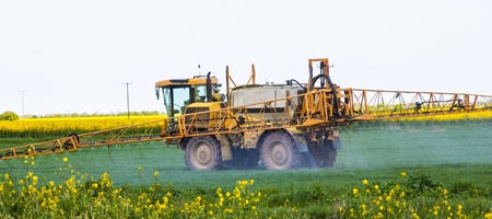A tractor spraying cropsの写真素材