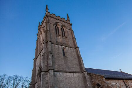 Church tower with a blue skyの写真素材