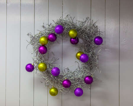 christmas wreath on a white wooden background,の写真素材