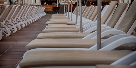 Sun beds by poolの写真素材