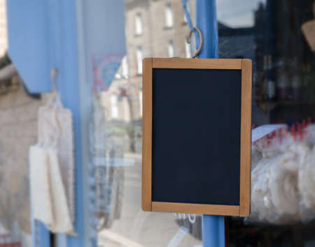 Empty sign hanging outside of a small shopの写真素材