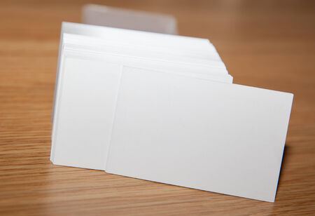 Business card pile on desk