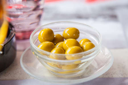 Green olives in a bowlの写真素材