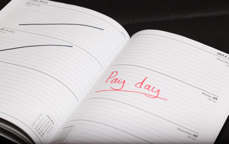Pay day highlighted in a diaryの写真素材