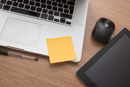 Modern desk with laptop and tabletの写真素材
