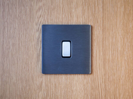 Light switch on a wood の写真素材