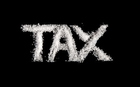 The word tax spelt out in sugar to represent sugar taxの写真素材
