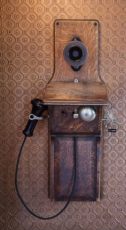 Very old wooden telephone on wallの写真素材