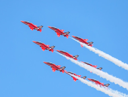 CLEETHORPES, ENGLAND JULY 27TH: Royal Air Force Red arrows perform an aerobatic display at Cleethropes airshow on 27th July 2014 in Cleethorpes England.のeditorial素材